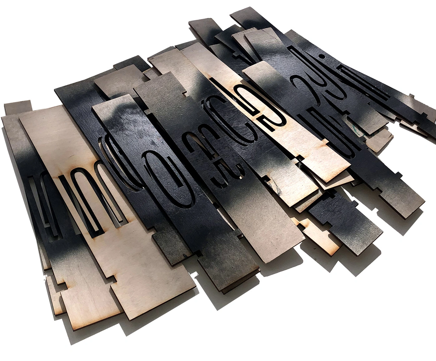 Image of designed type, used digitally, cut out of wood and spraypainted use.